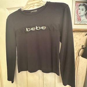 A cute BEBE TOP IN A SIZE SMALL - medium 💫